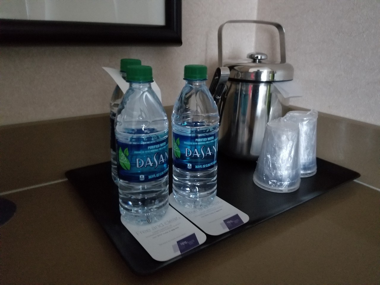 a group of water bottles on a tray