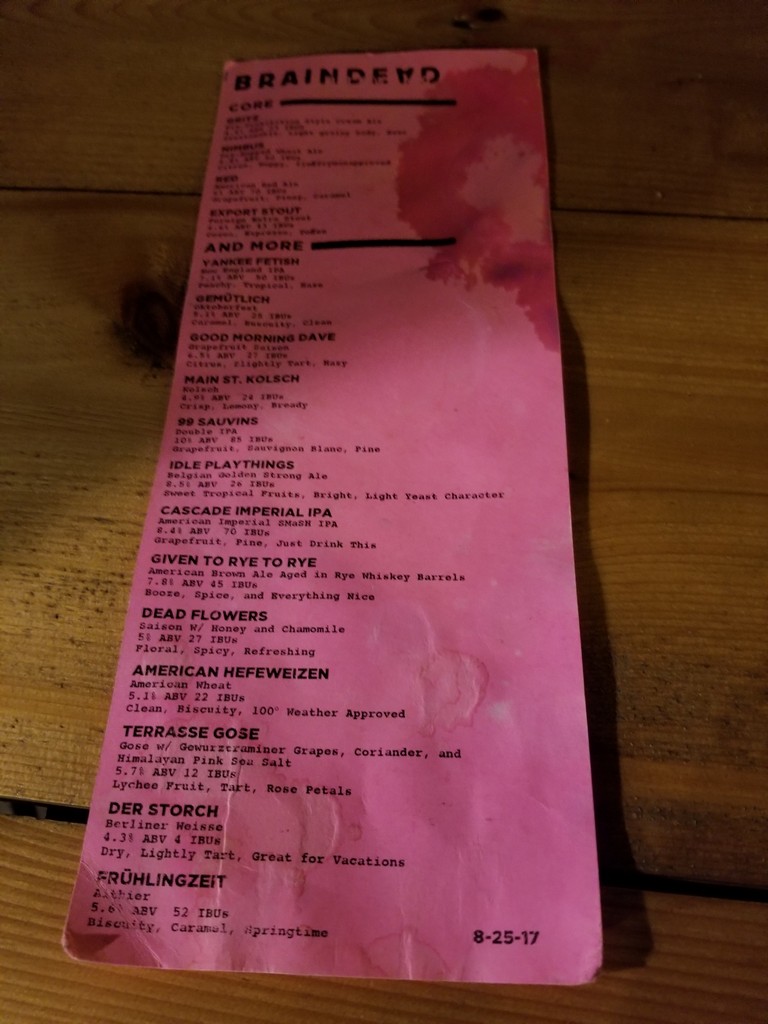 a pink paper with black text on it