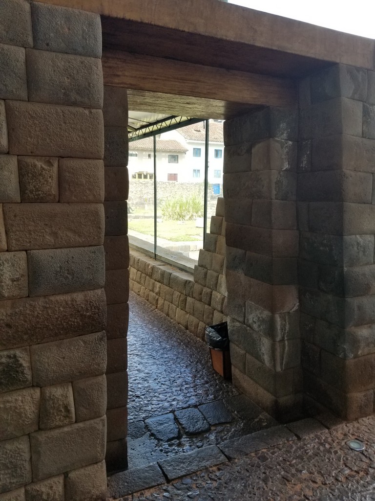 a stone archway with a window