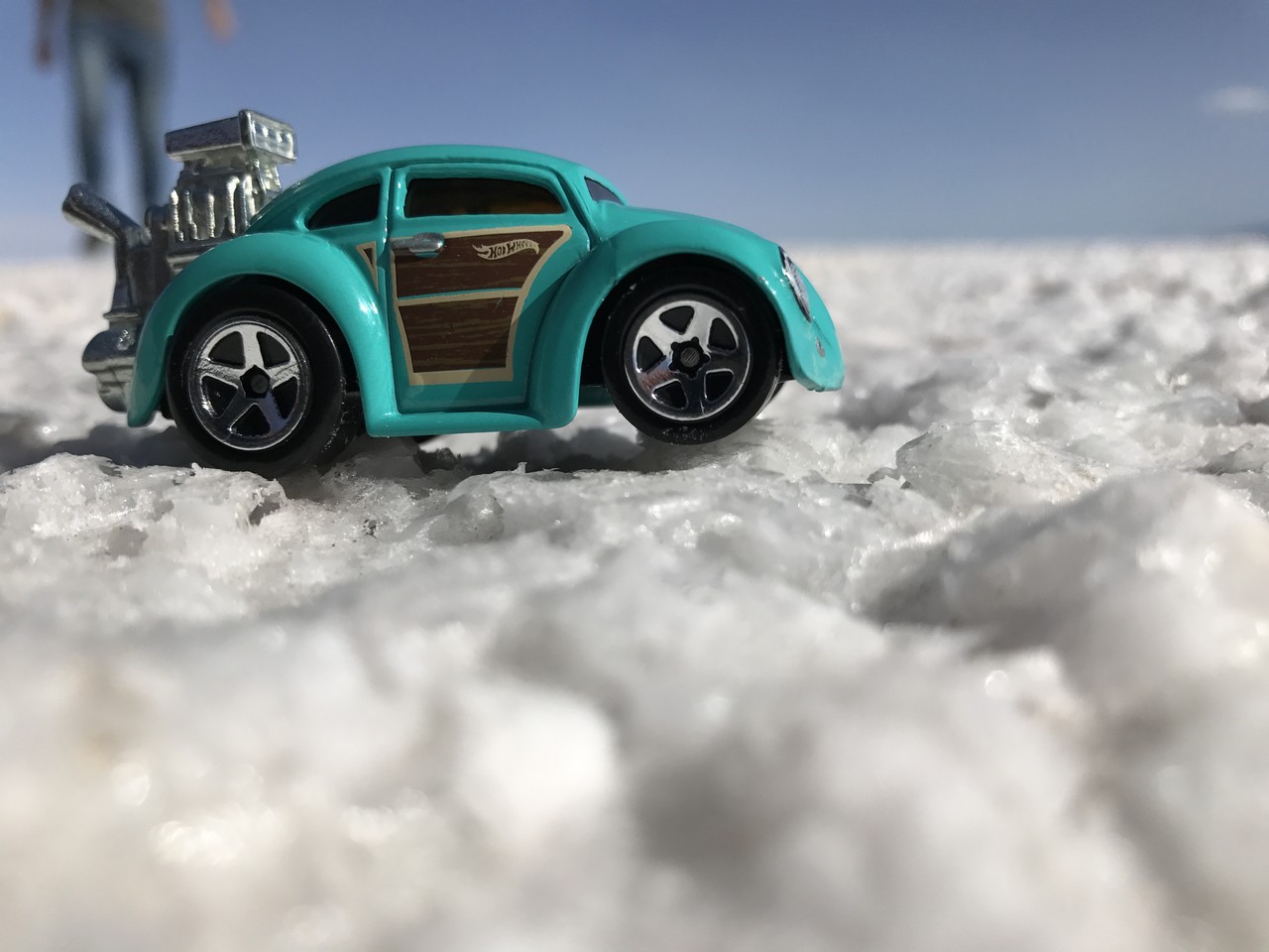 a toy car on snow