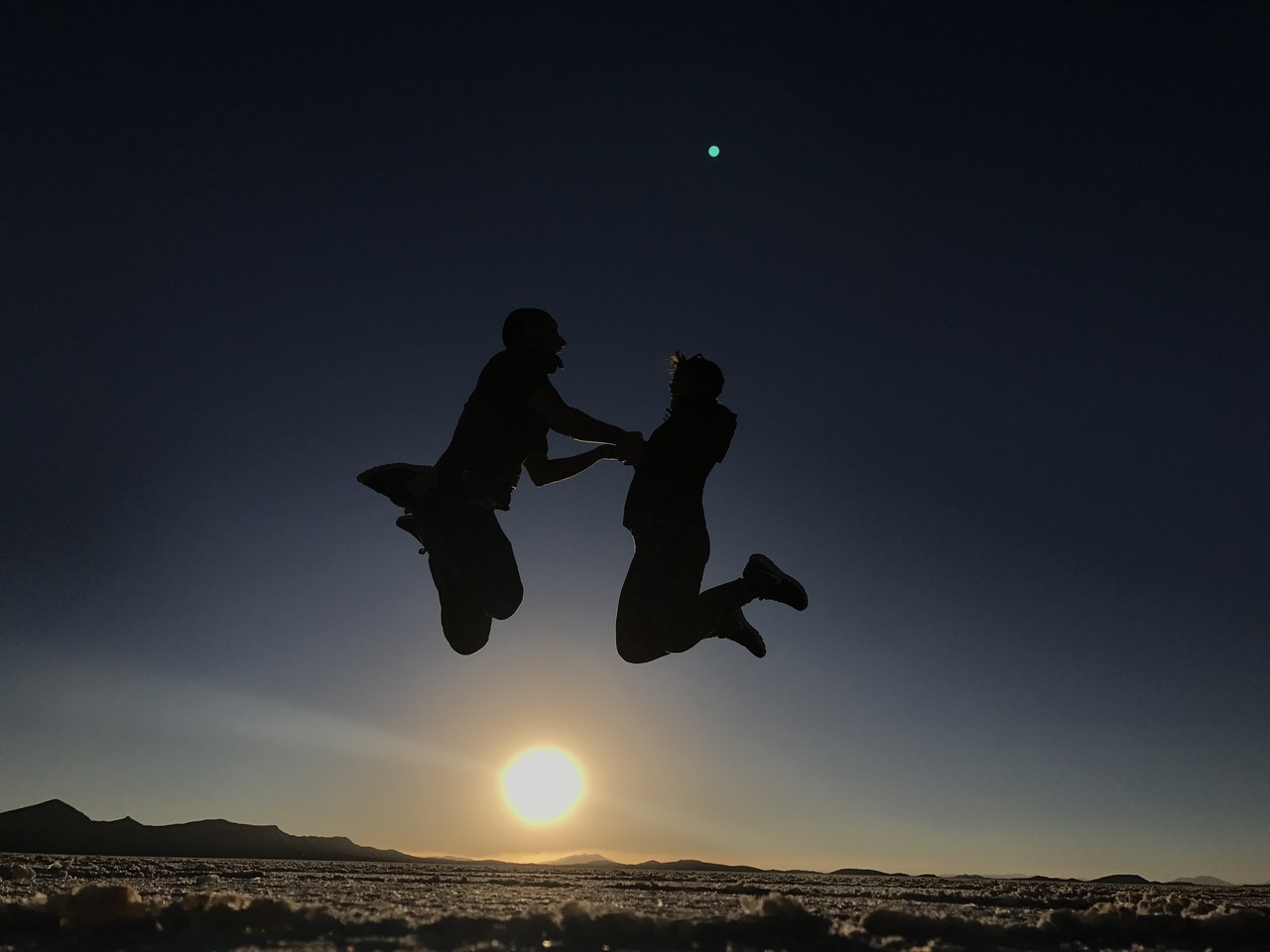 two people jumping in the air