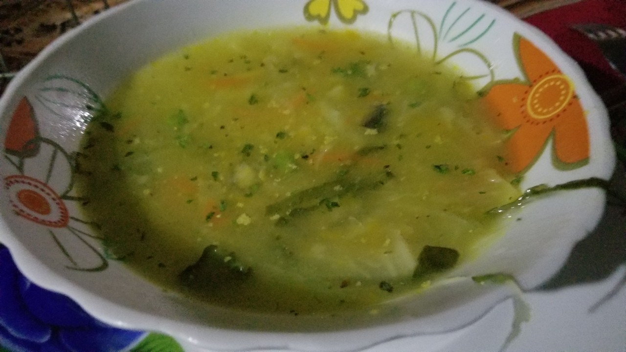 a bowl of soup with vegetables