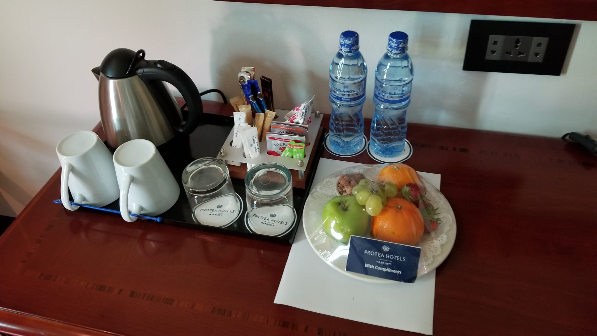 a tray of food and water bottles on a table
