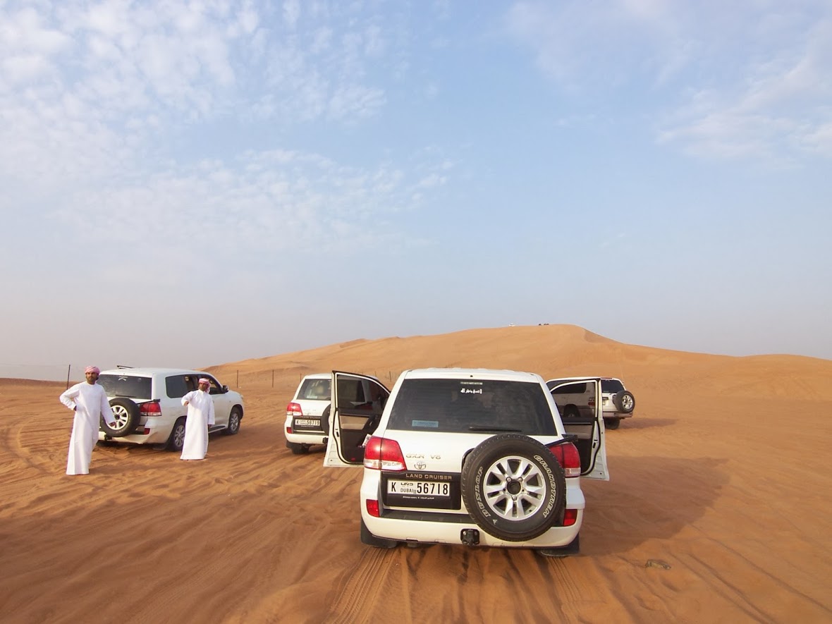 a group of cars in a desert