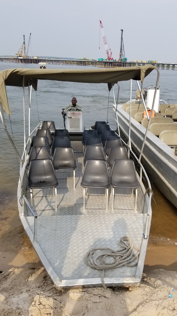 a boat with seats on the water