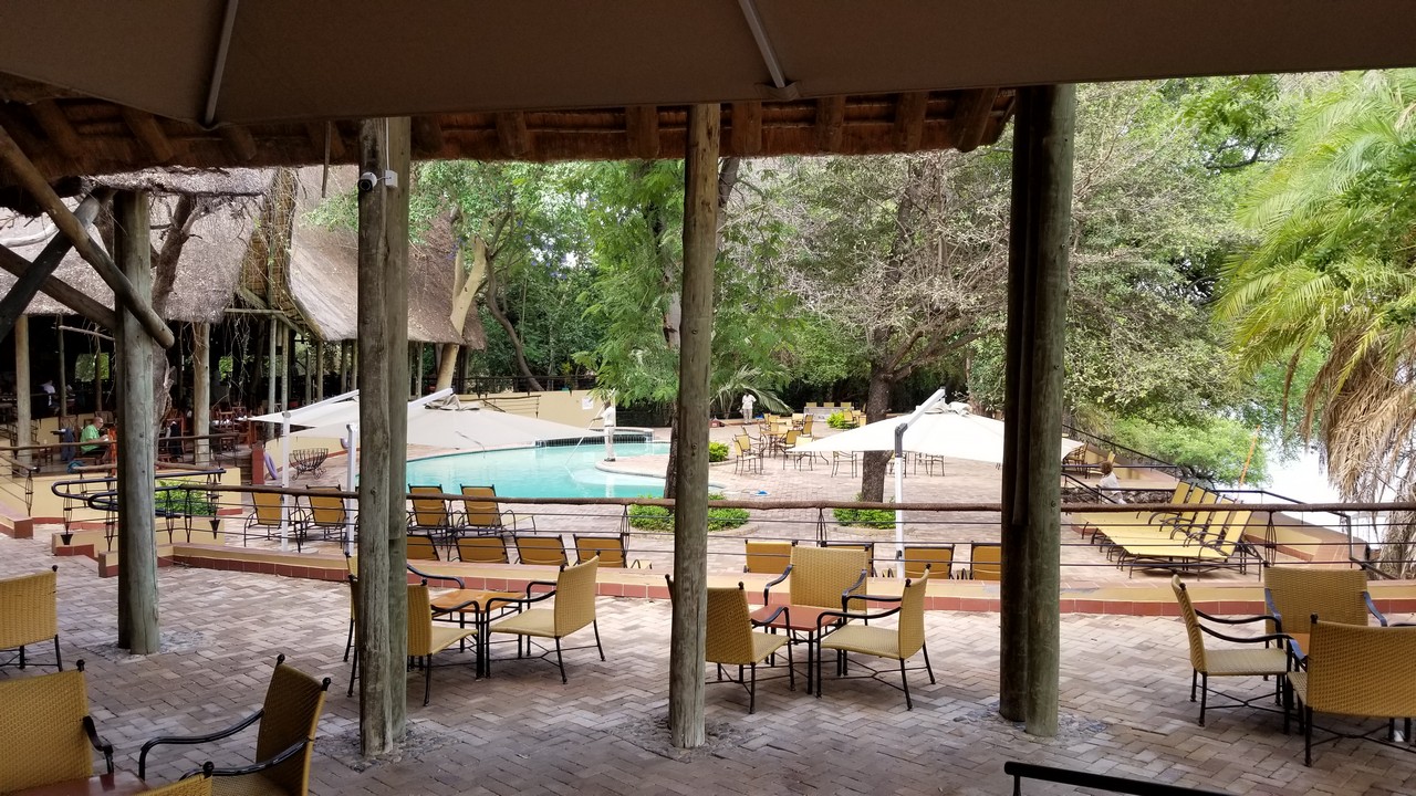 a pool and tables outside