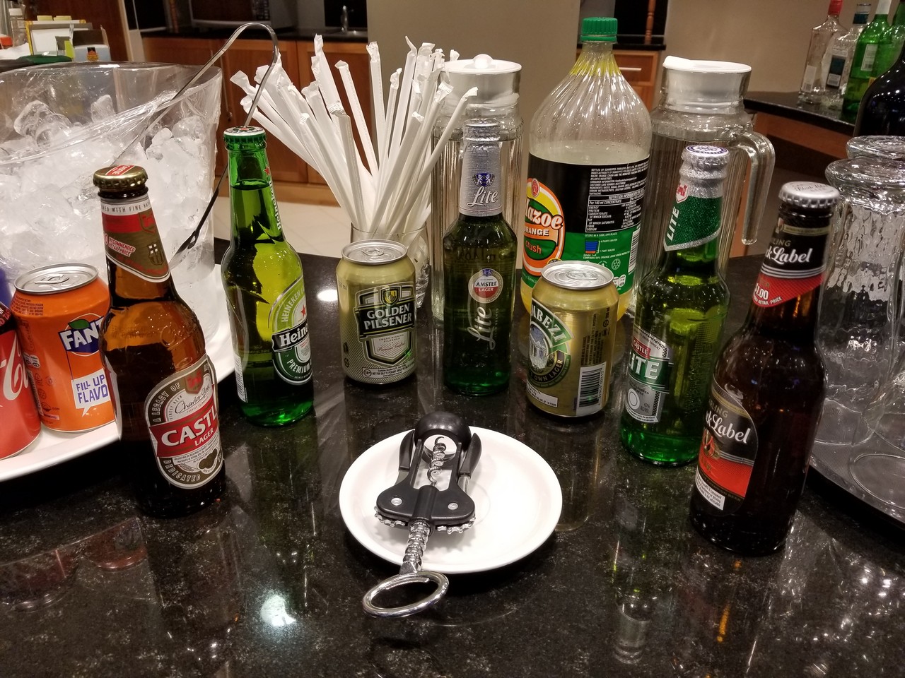 a group of bottles and a key on a table