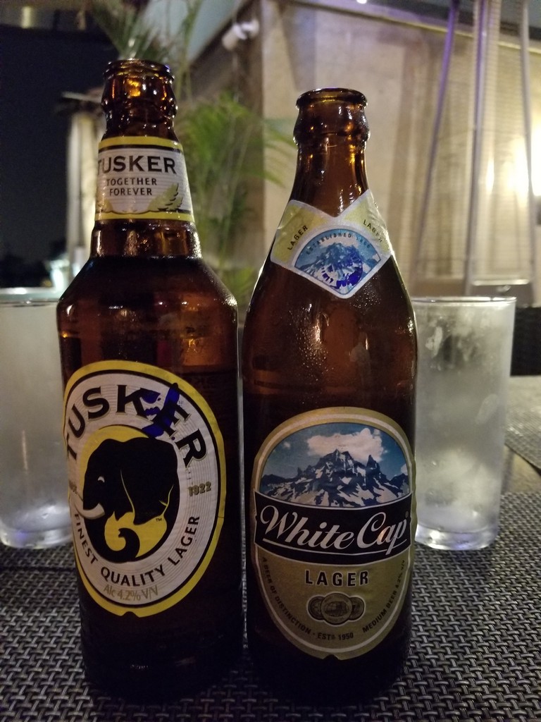 two bottles of beer on a table