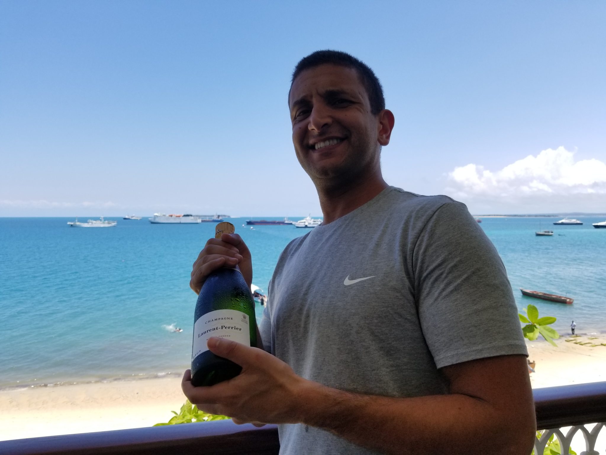 a man holding a bottle of champagne
