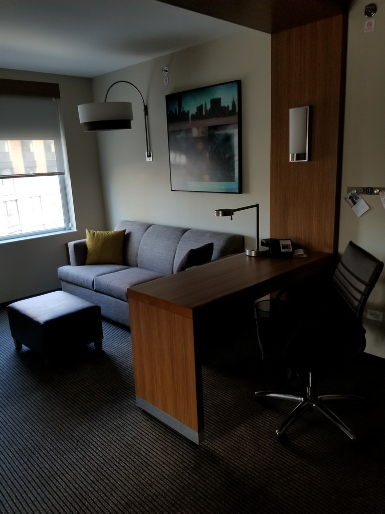 a room with a couch and a desk