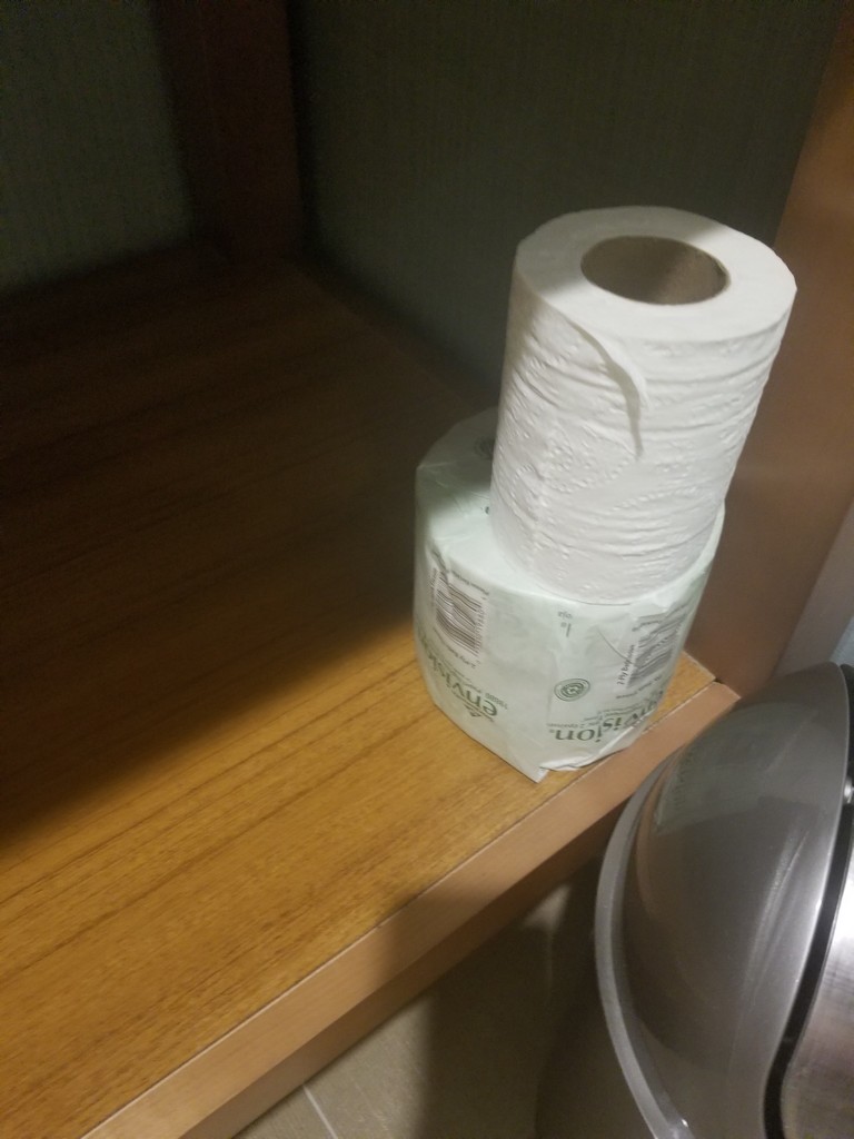 a roll of toilet paper on a shelf
