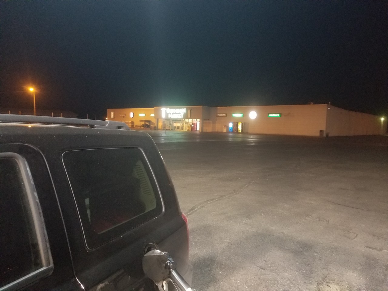 a car parked in a parking lot at night