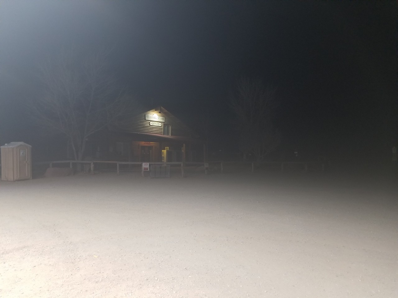 a building in the fog at night