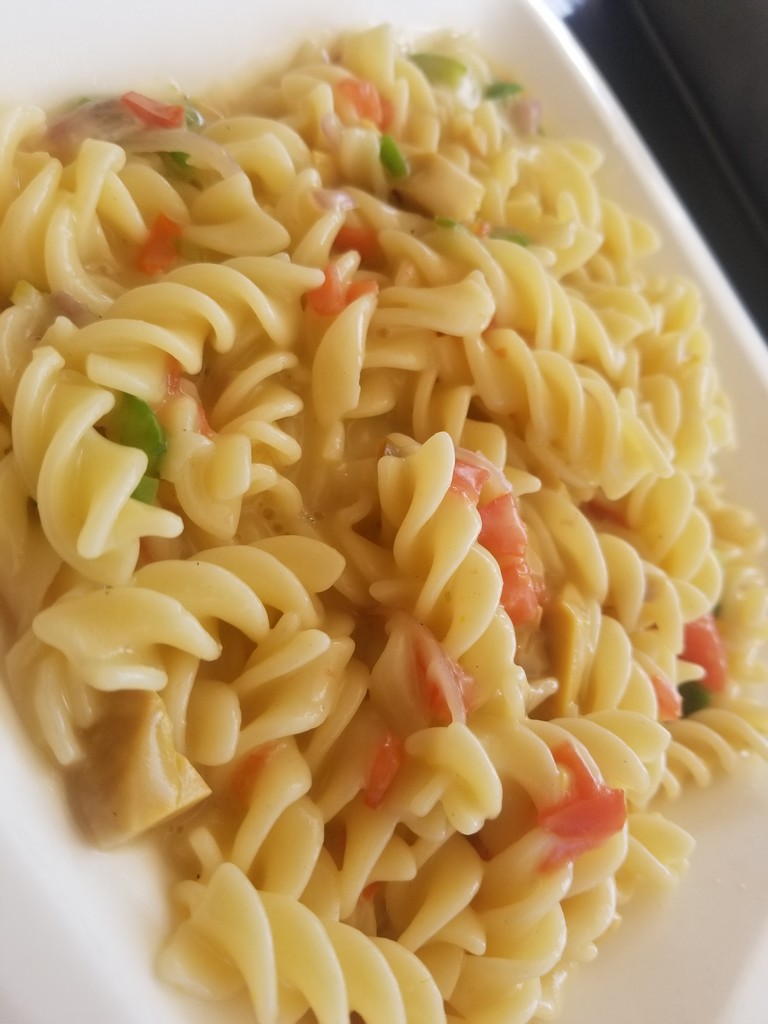 a plate of pasta with vegetables