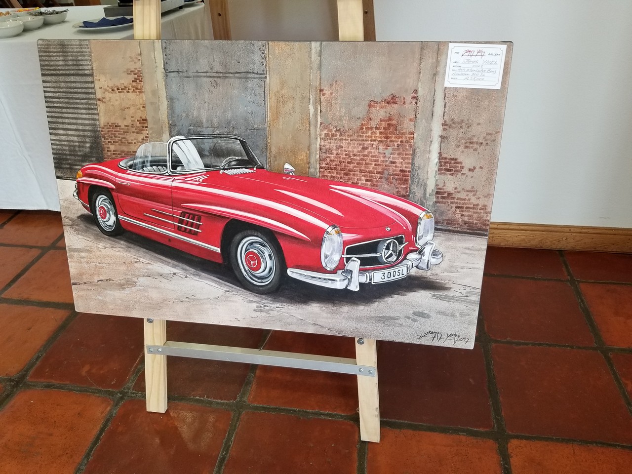 a painting of a red car on a stand