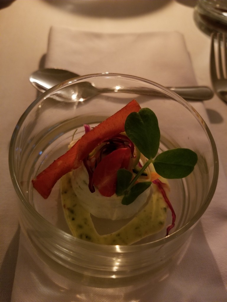 a glass cup with food in it