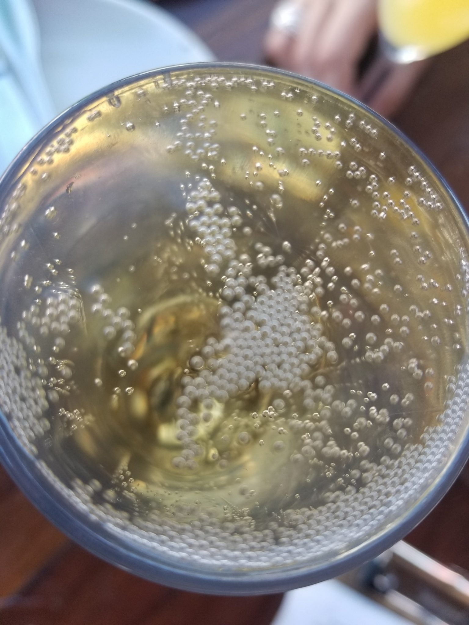 a glass of liquid with bubbles