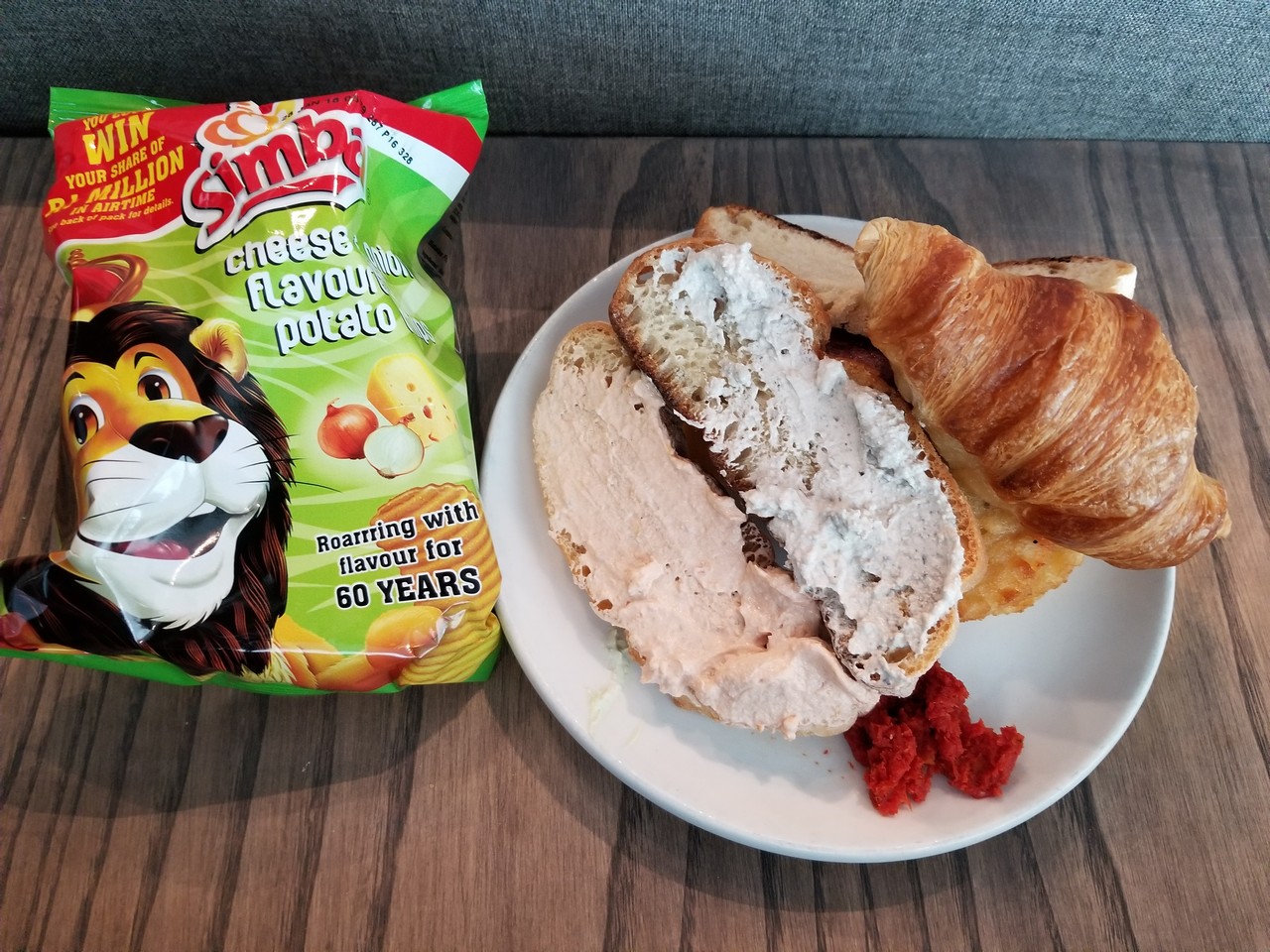 a sandwich and a bag of chips on a table
