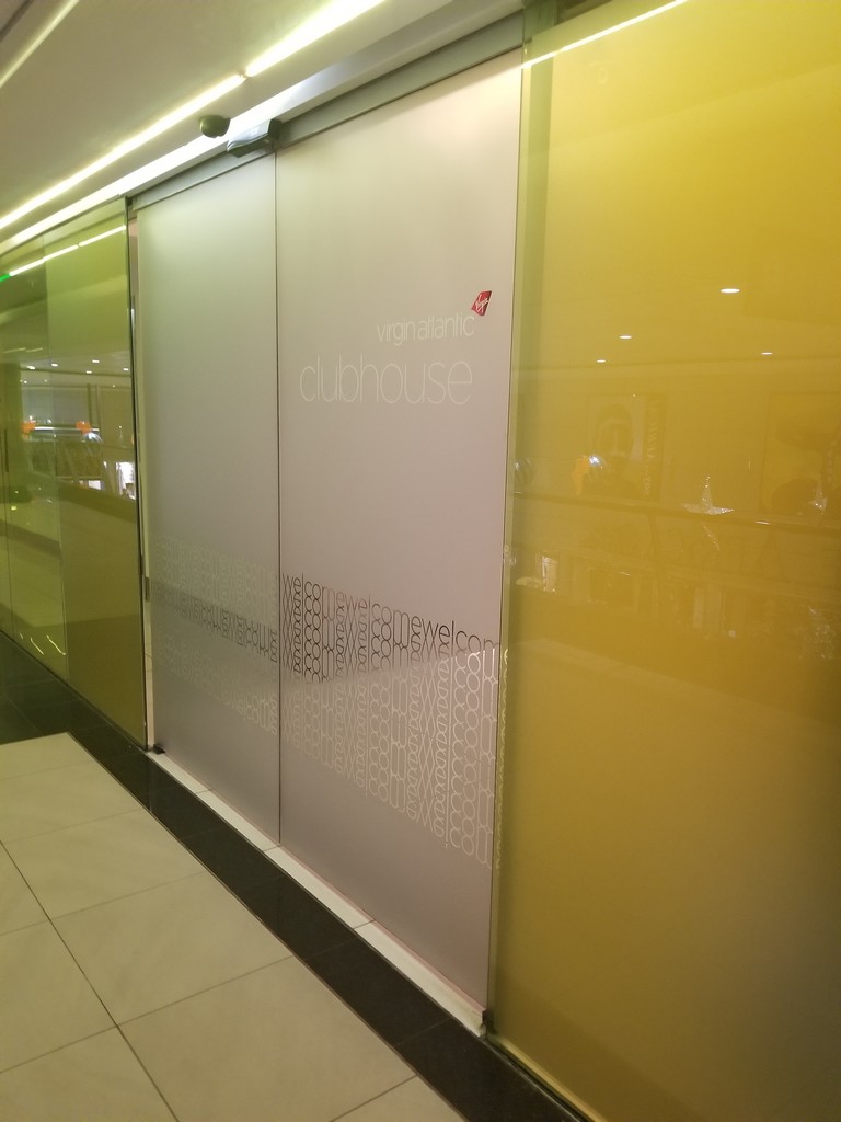 a glass wall with a sign on it