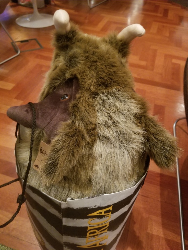 a stuffed animal in a bucket