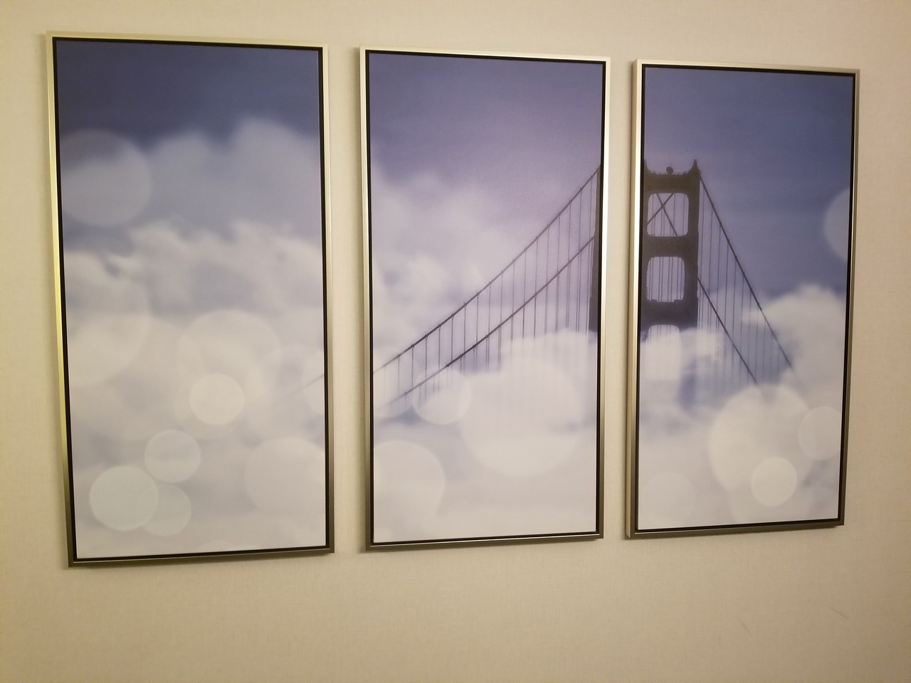 a three framed pictures of a bridge