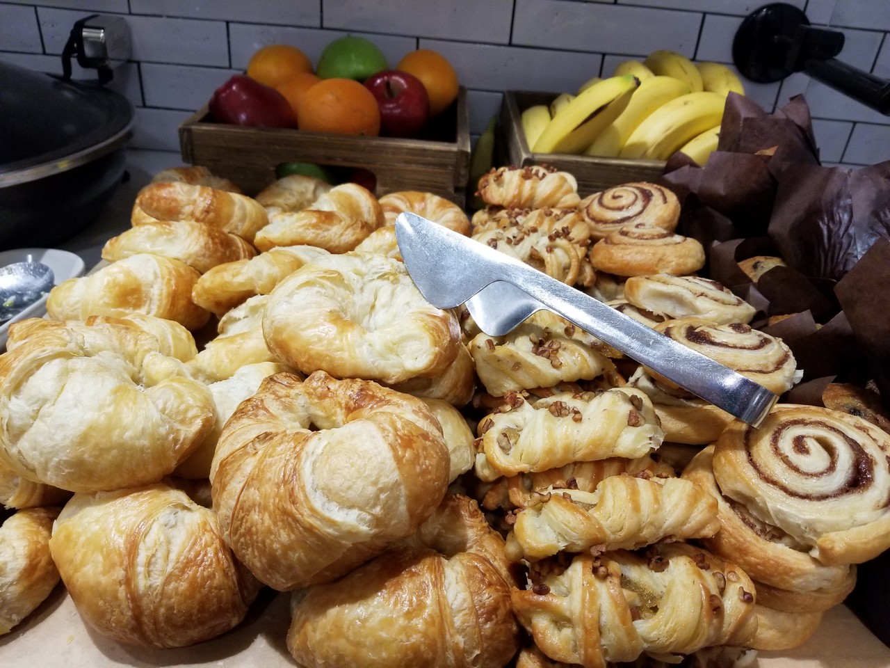 a table full of pastries and fruits