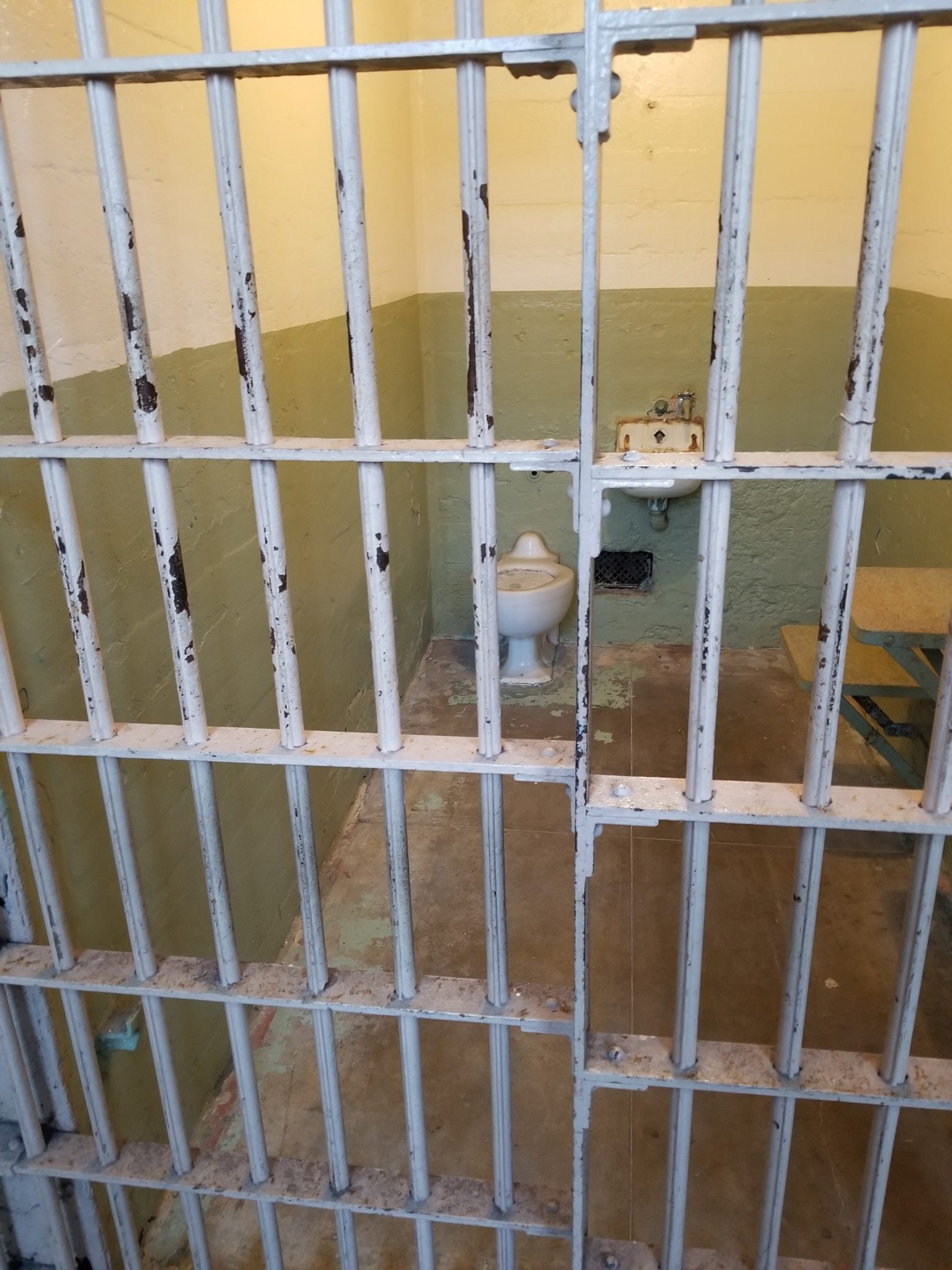 a prison cell with bars