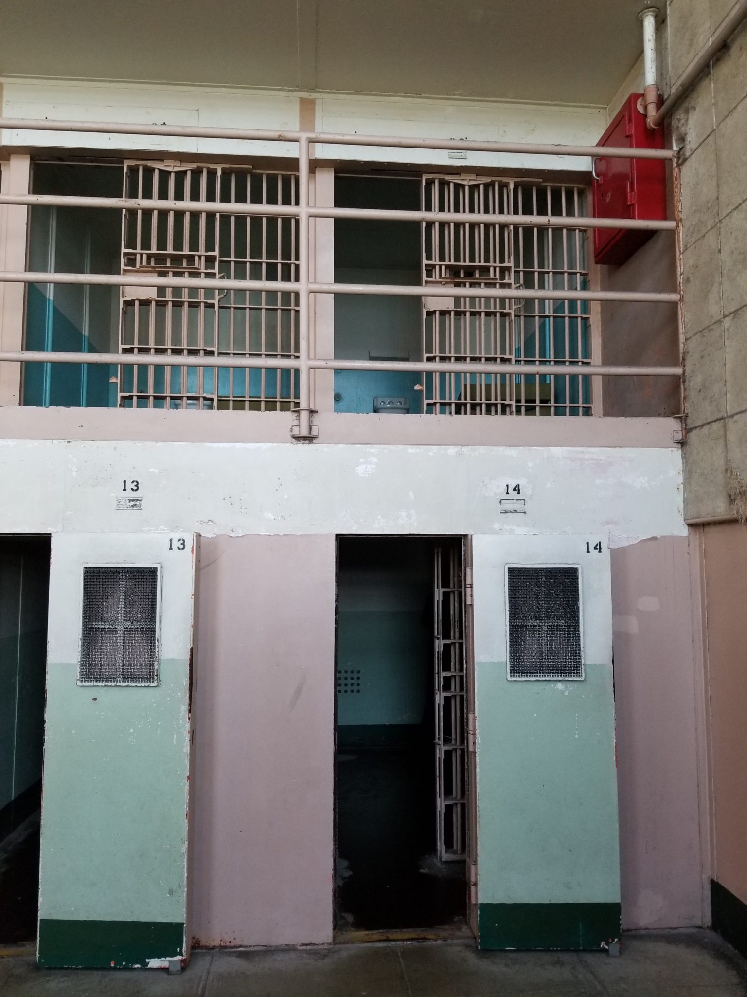 a jail cell with bars