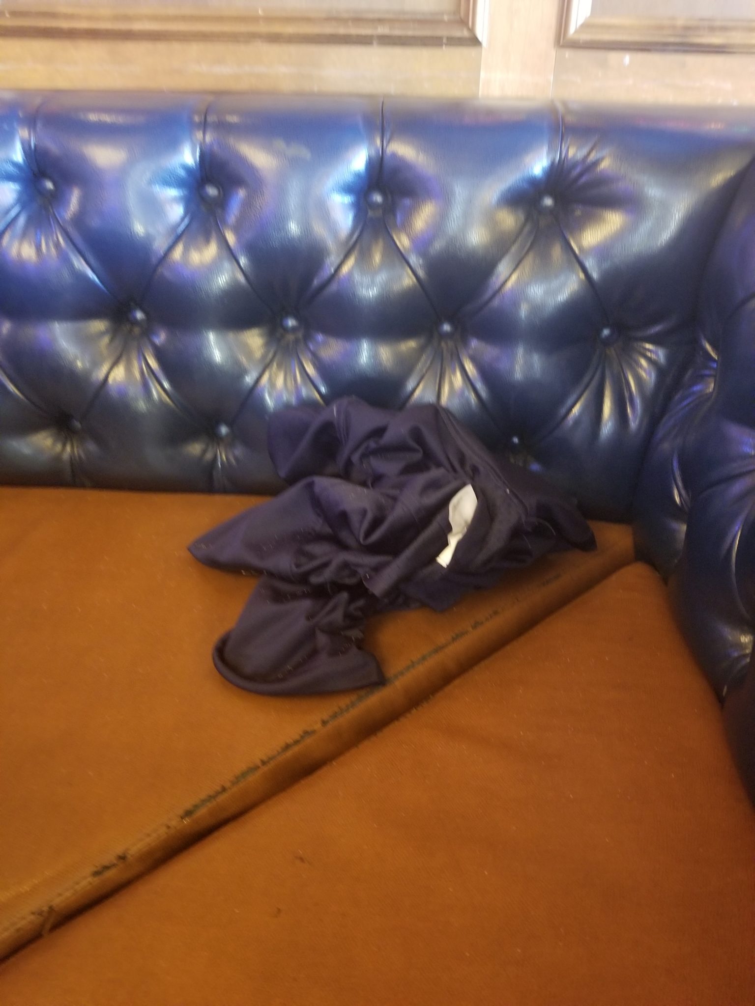 a blue cloth on a couch