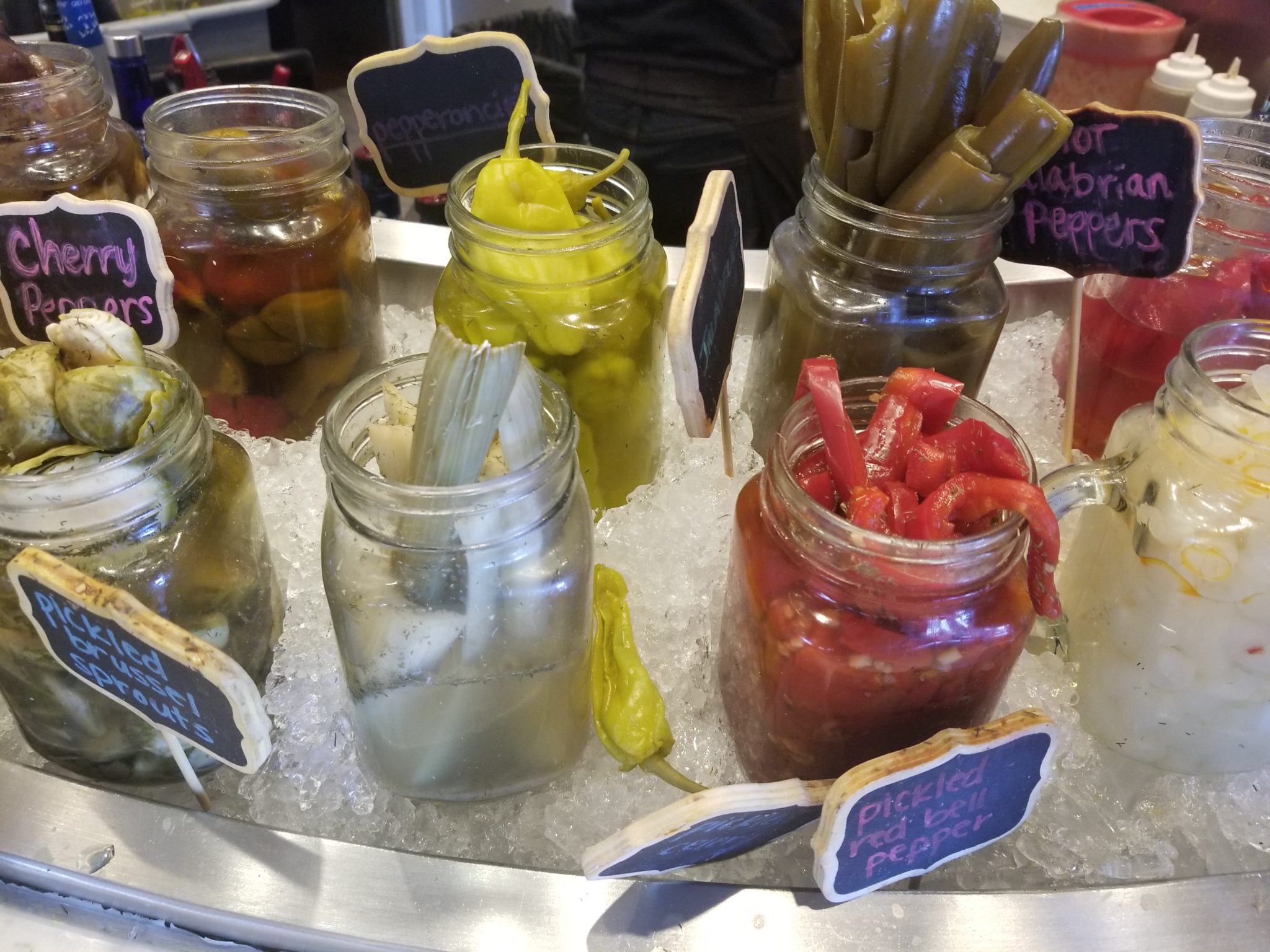 jars of pickles on ice