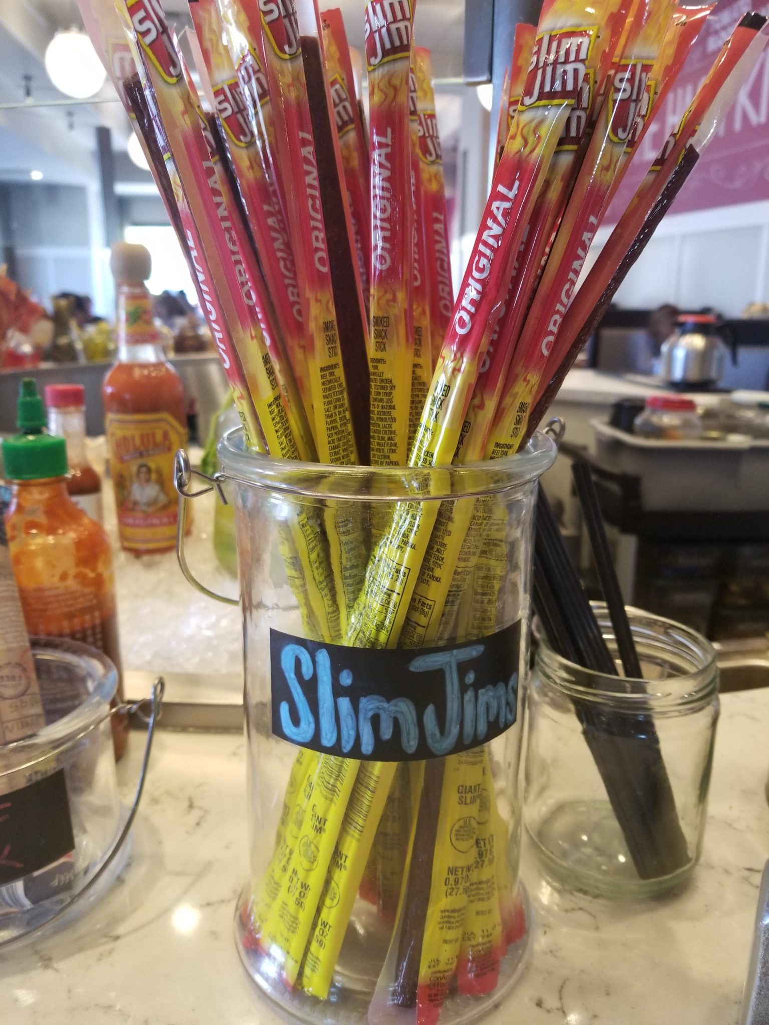 a jar of pencils in a restaurant