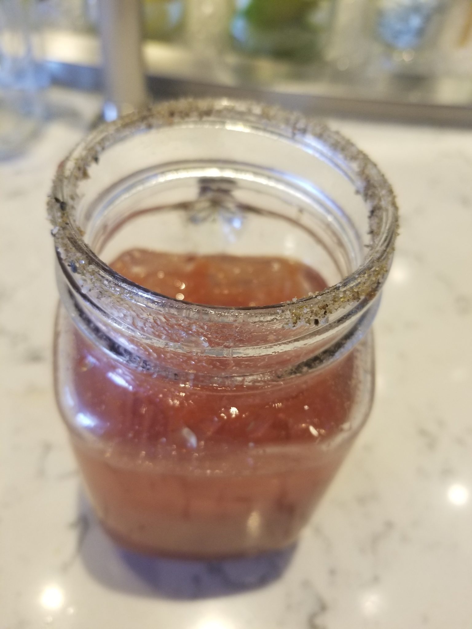 a jar with a red substance