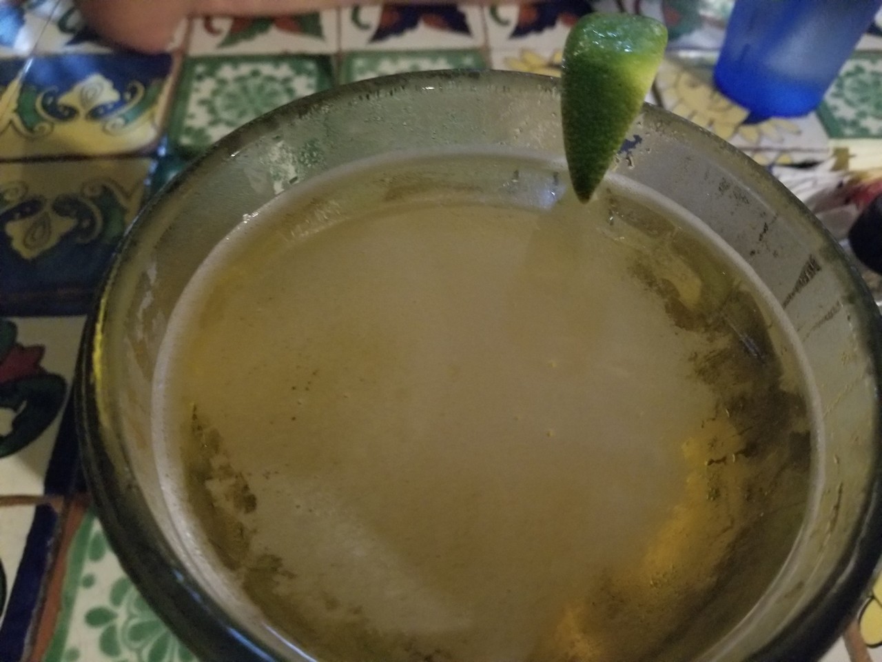 a lime on top of a drink
