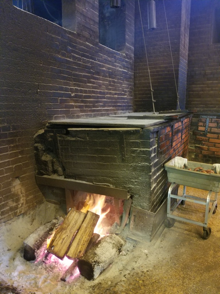 a brick oven with a fire in it