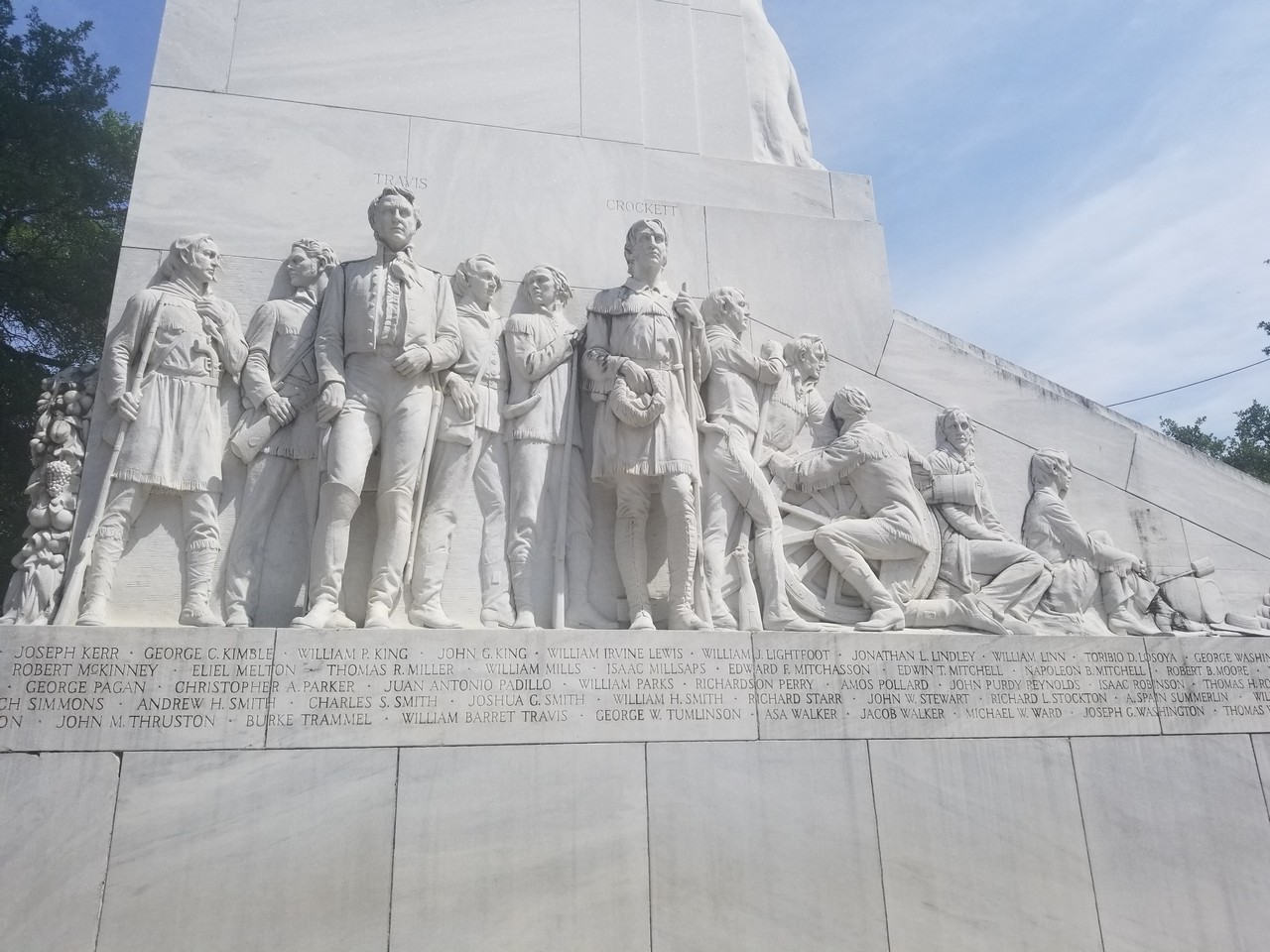 a statue of people on a monument