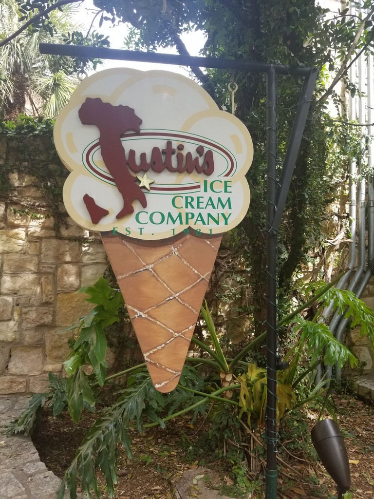 a sign in the shape of an ice cream cone