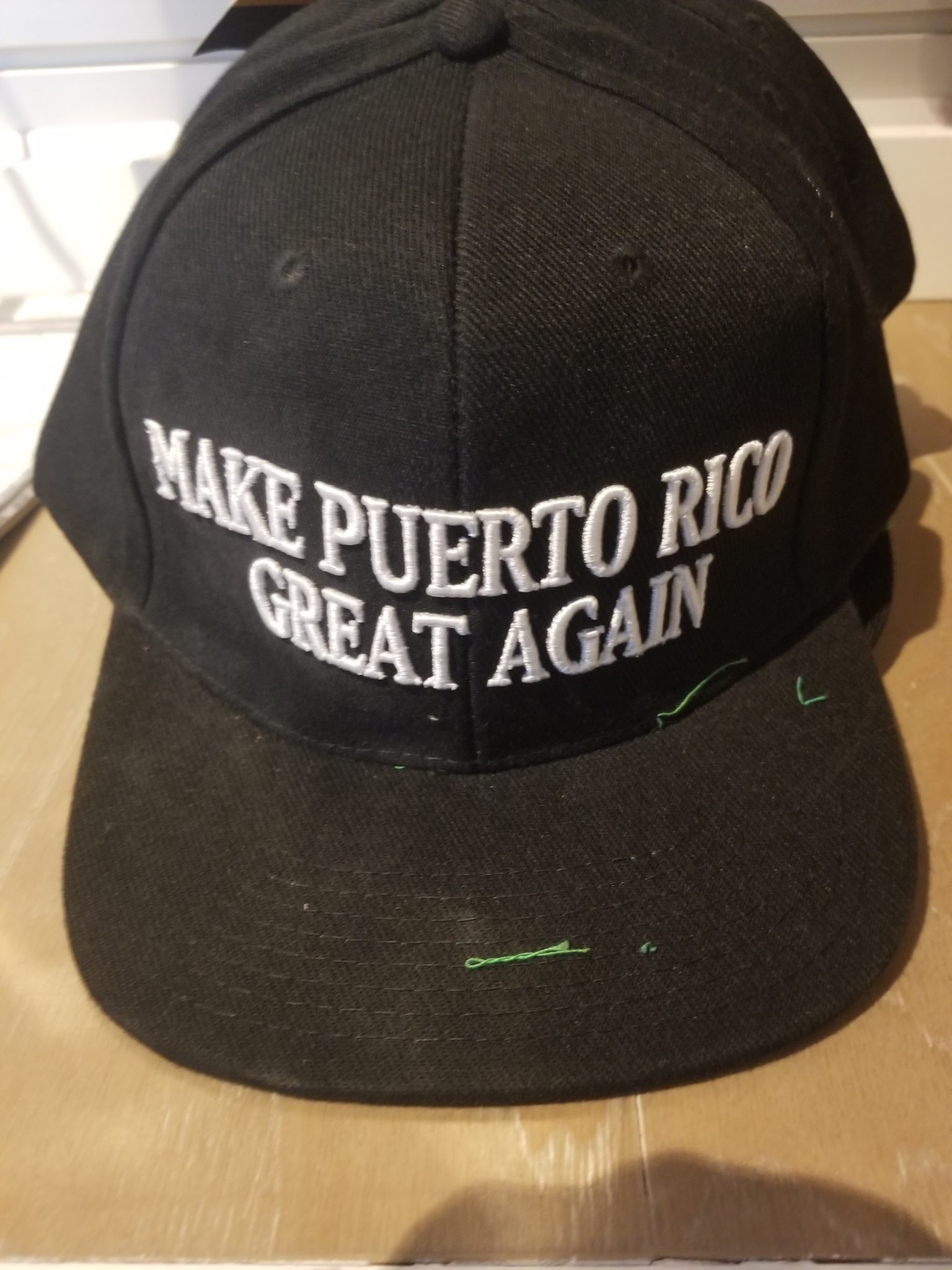 a black hat with white text on it