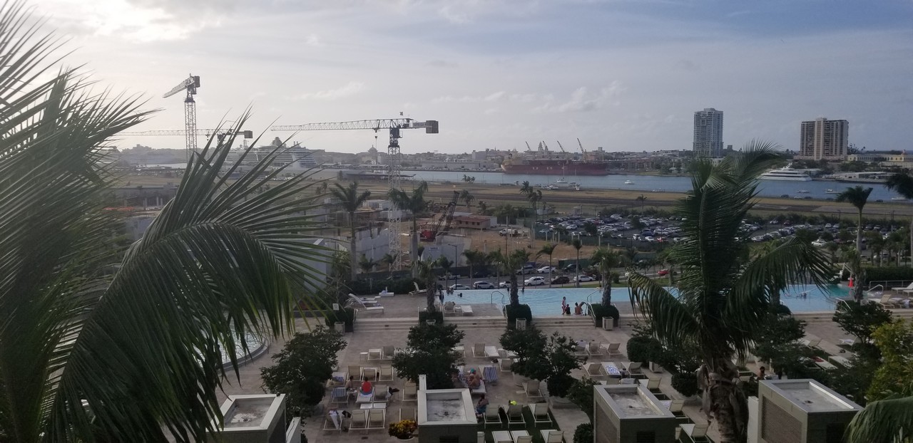 a pool with a crane in the background