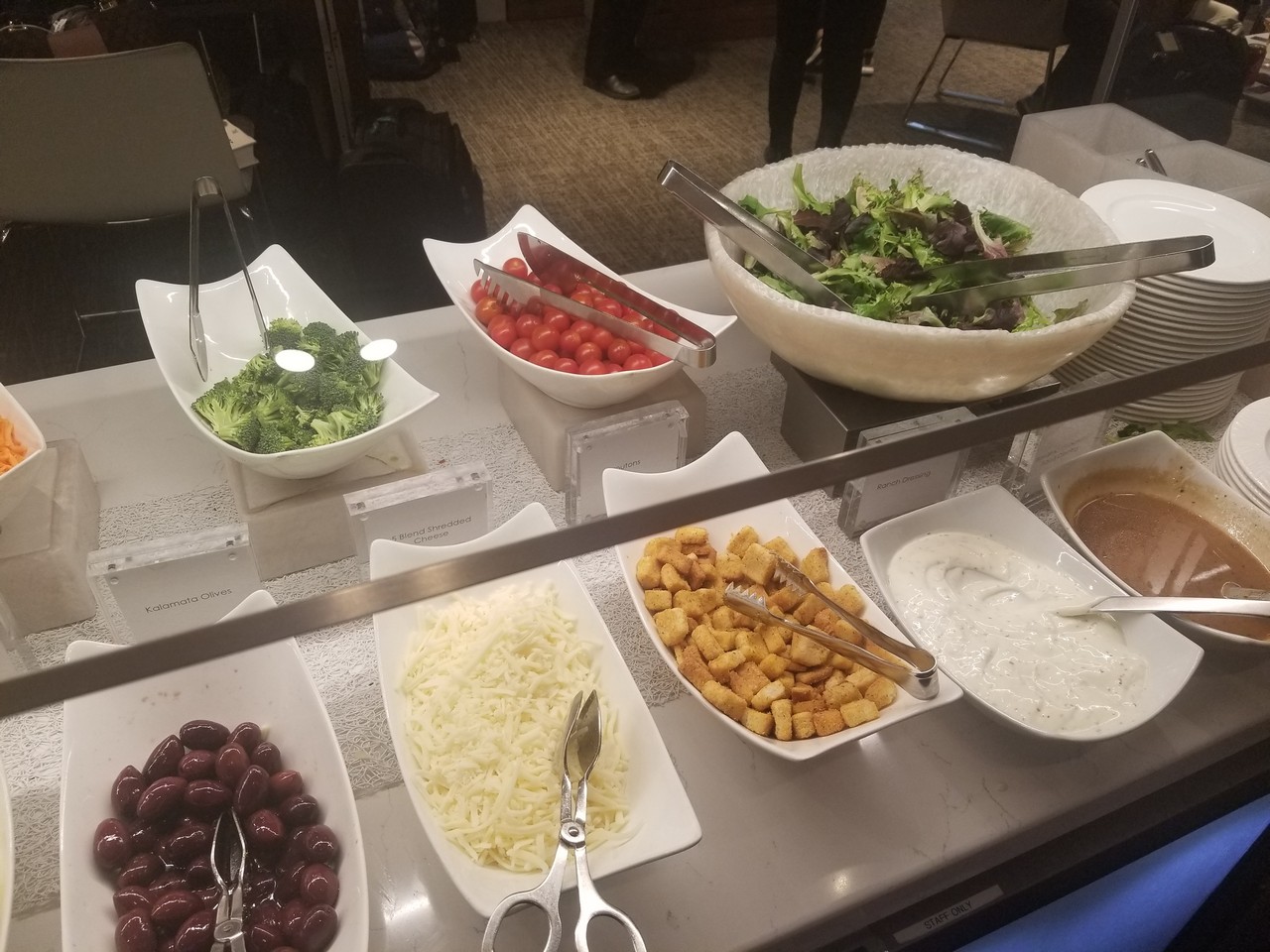 a buffet with different bowls of food