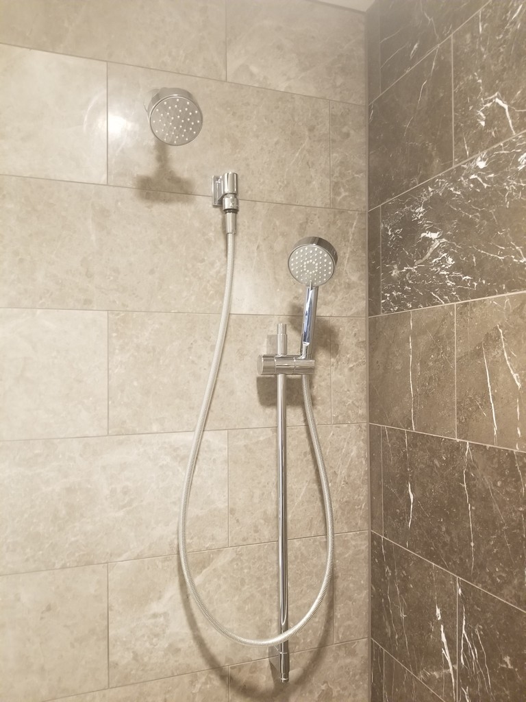 a shower head and hose in a shower