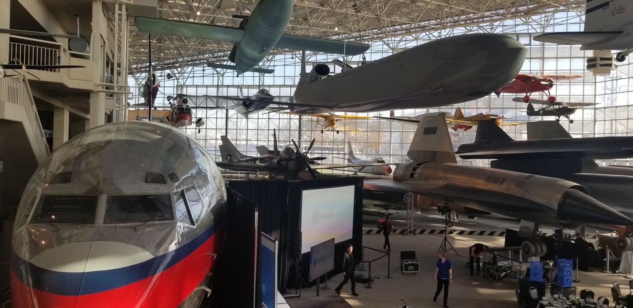 a group of airplanes in a hangar