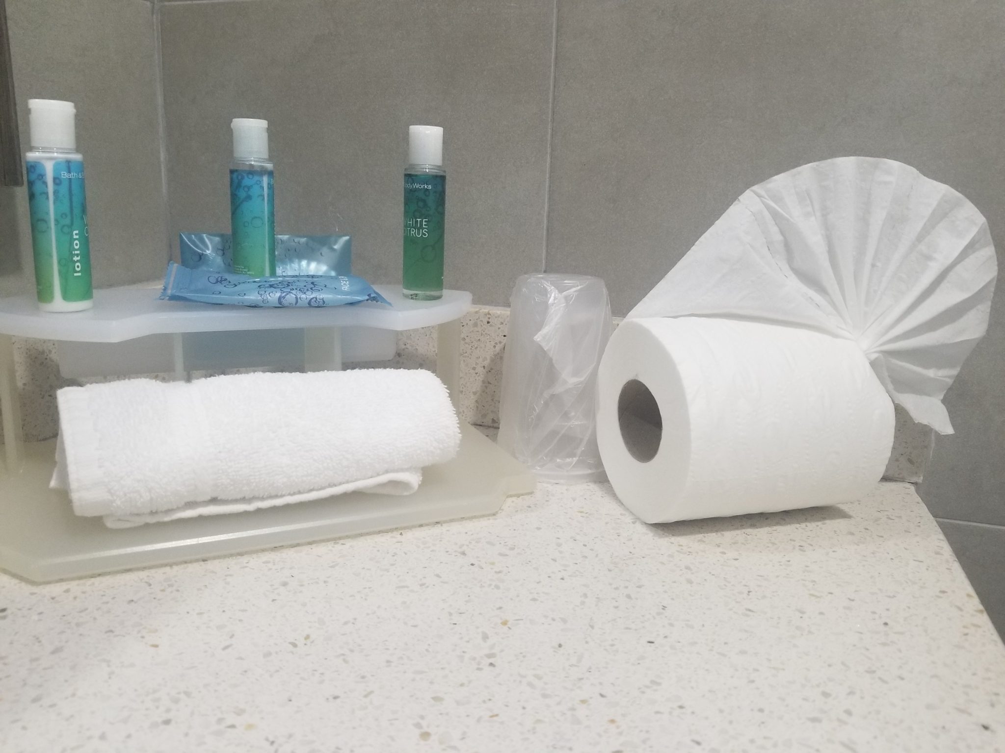 a group of toilet paper rolls and hand sanitizer
