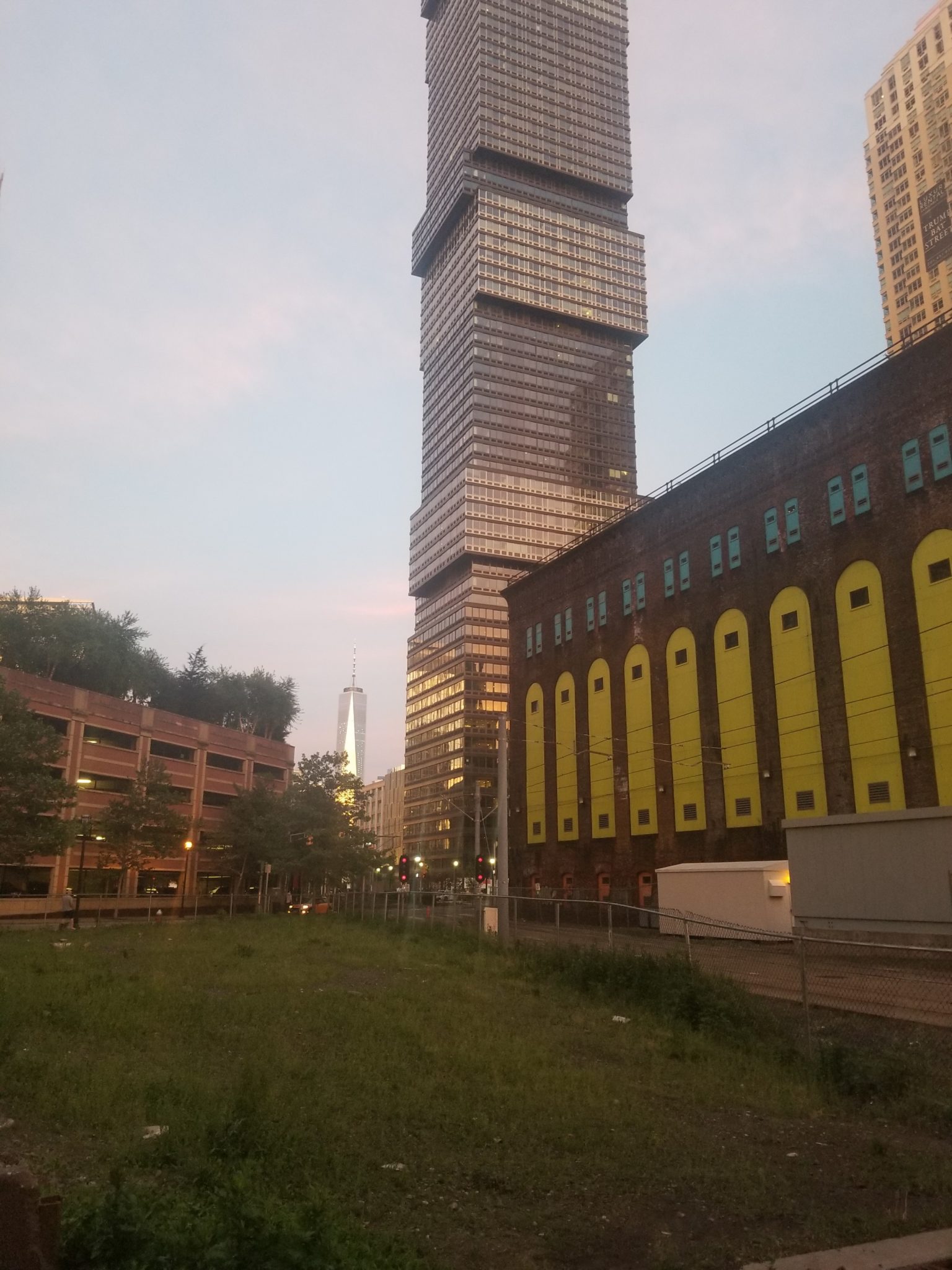 a tall building next to a building