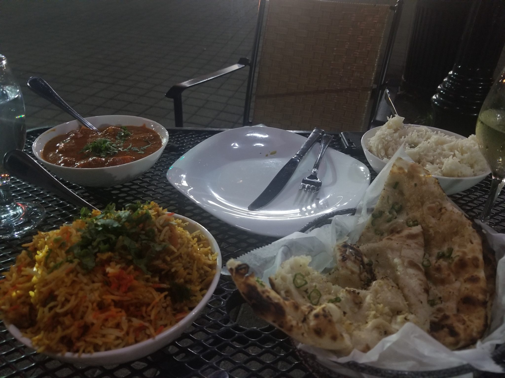 a table with plates of food and a fork