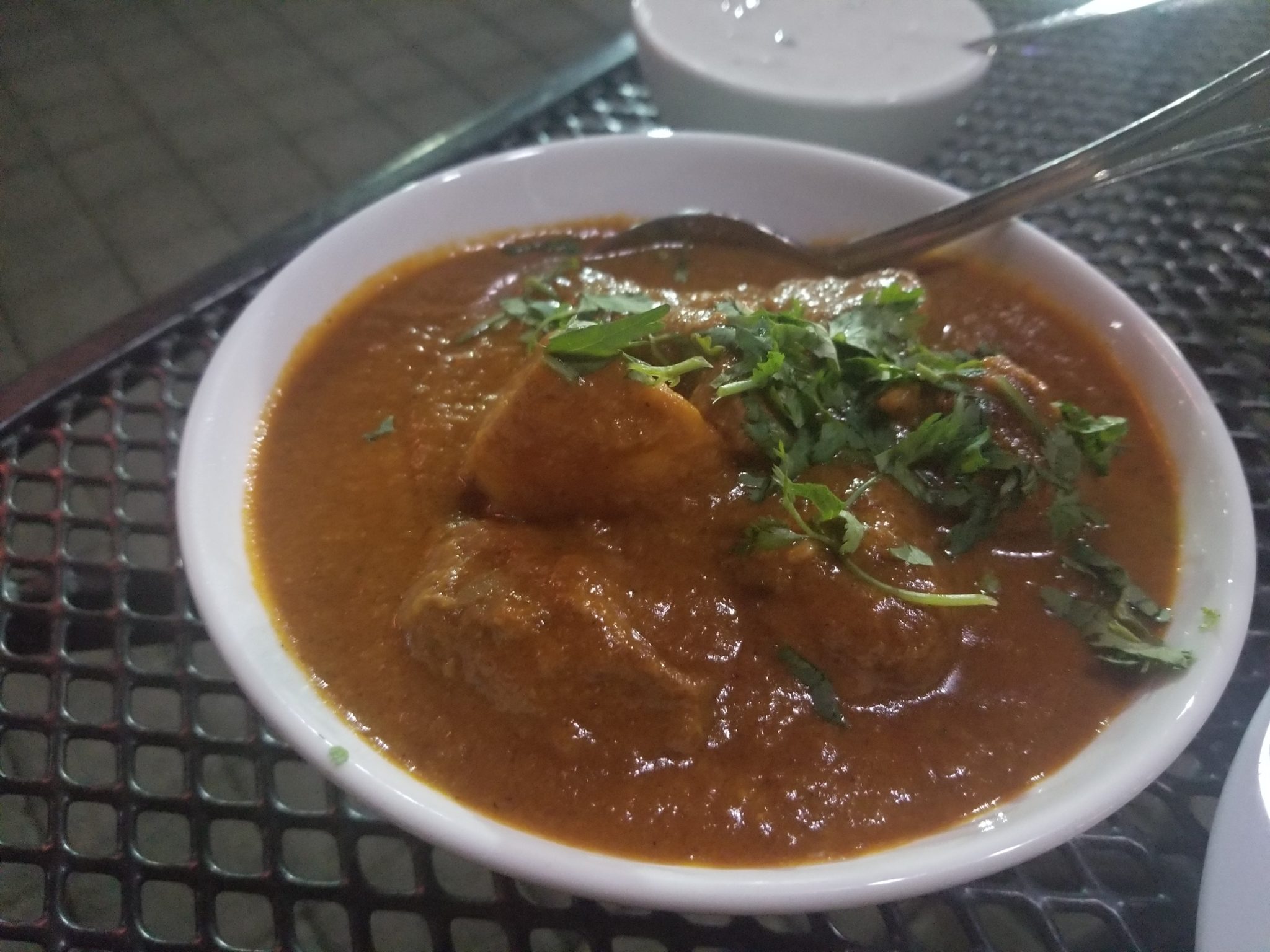 a bowl of food with a spoon