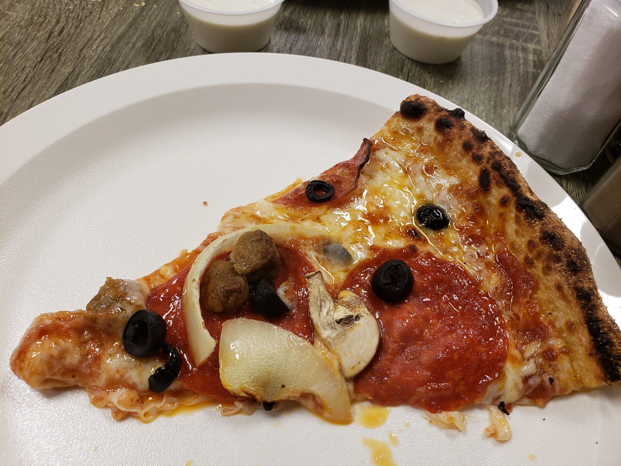 a slice of pizza on a plate