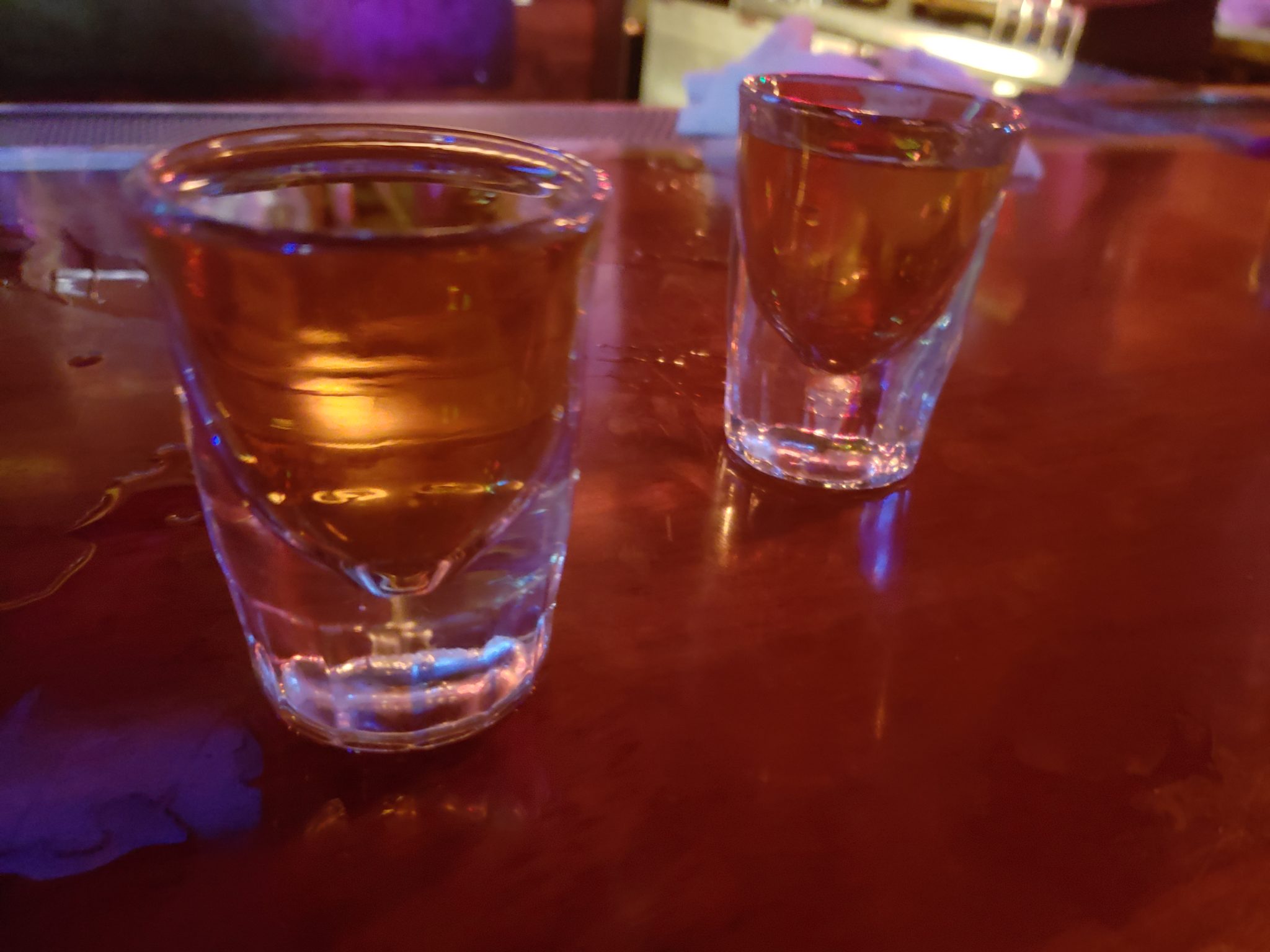 two shot glasses on a table