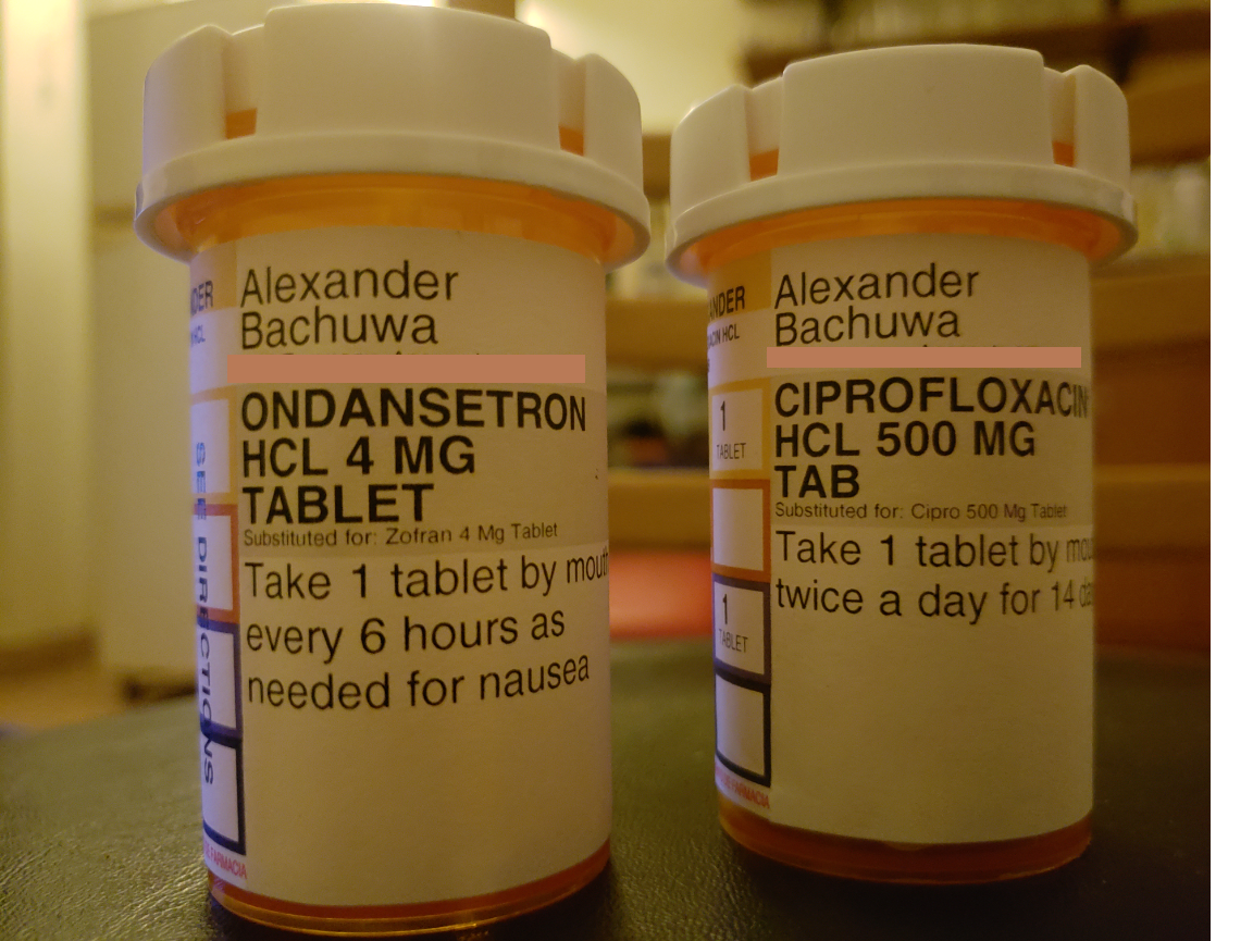 two bottles of pills on a table