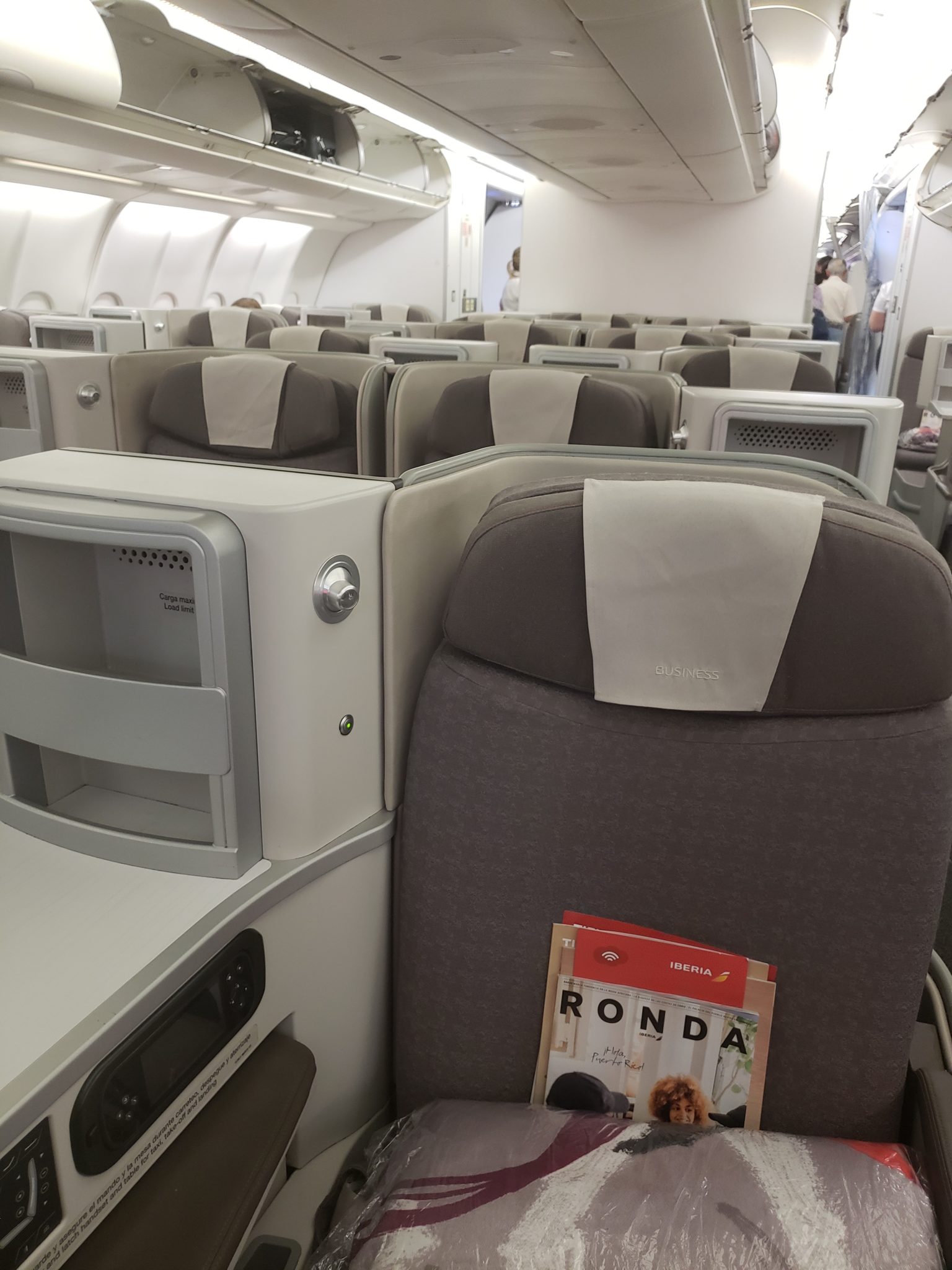 a plane with seats and a magazine