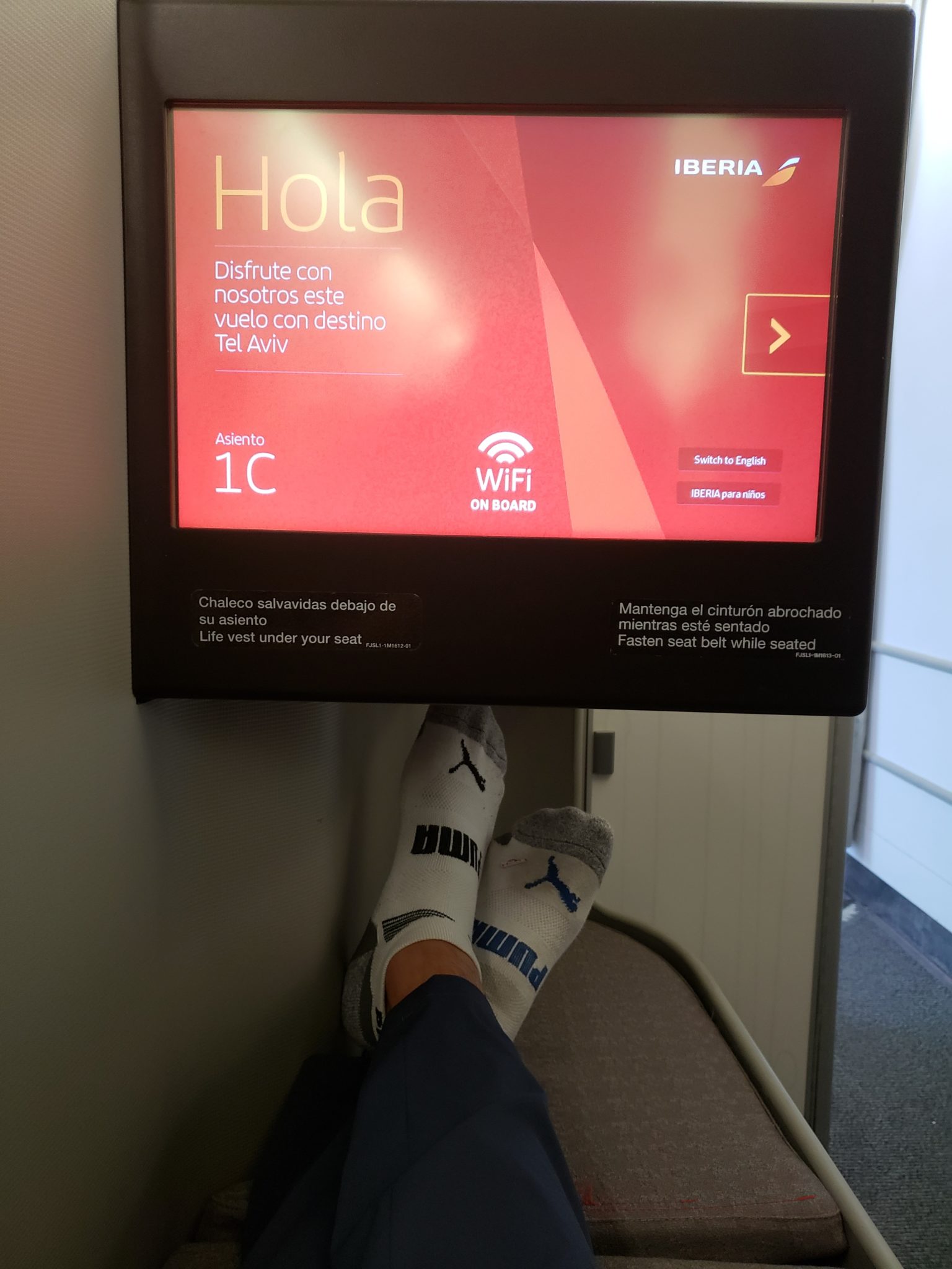 a person's feet in socks and a screen